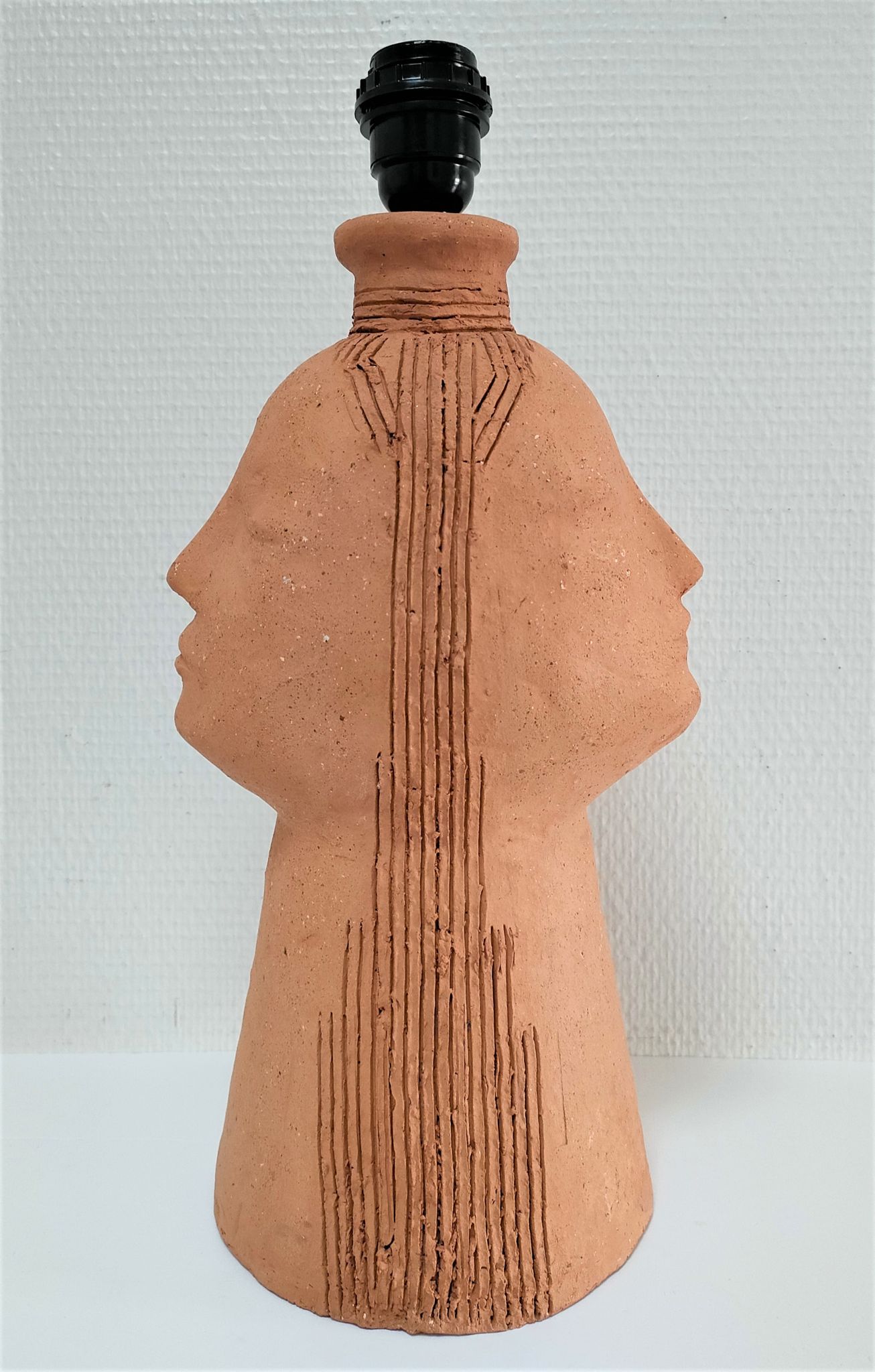 Anthropomorphic lamp foot depicting two faces terracotta design 80s
