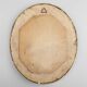 French Baroque style oval mirror in gilded wood with floral decorations