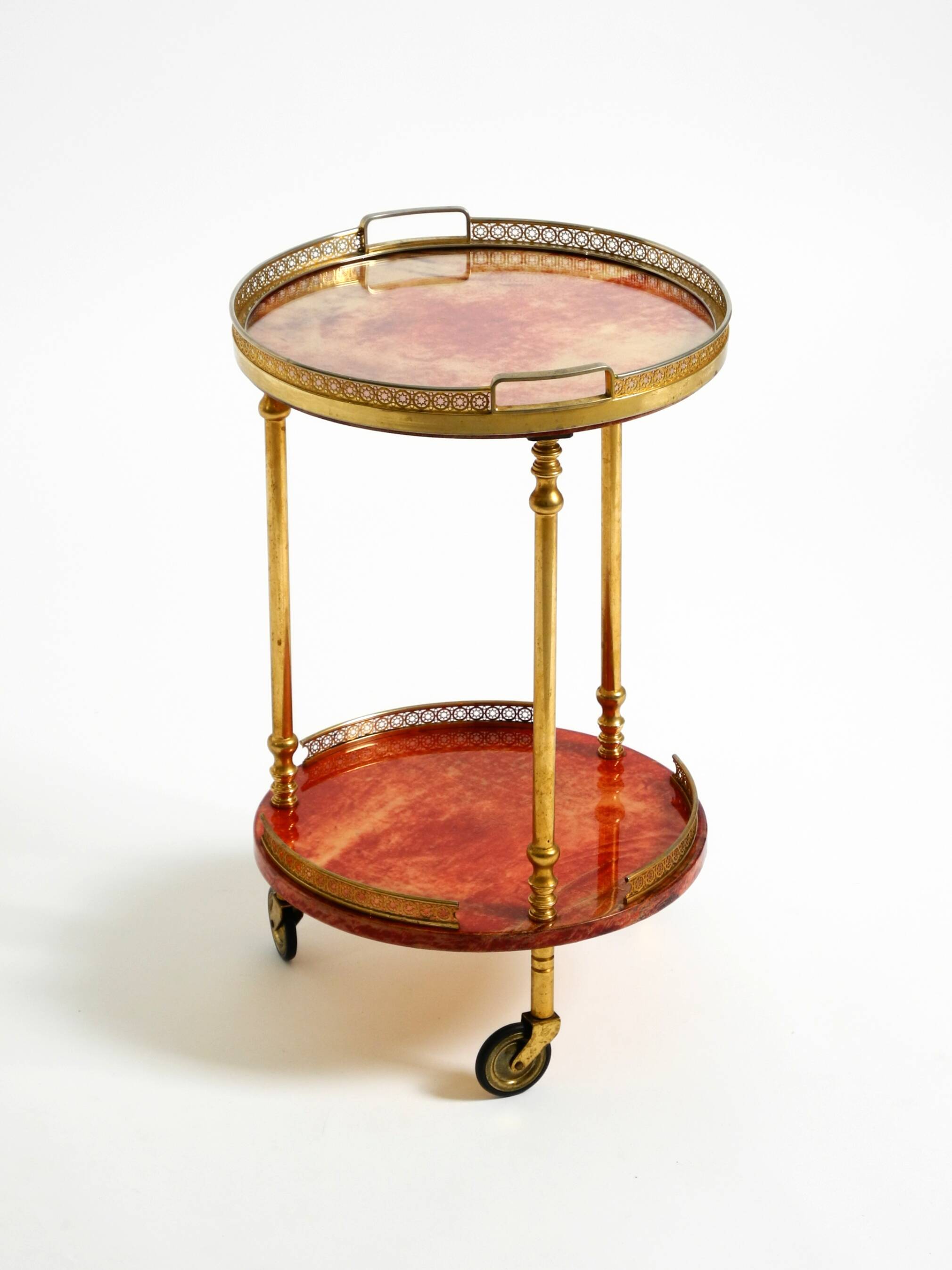 Round, small 1960s Aldo Tura serving or bar trolley in red goatskin leather