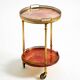 Round, small 1960s Aldo Tura serving or bar trolley in red goatskin leather