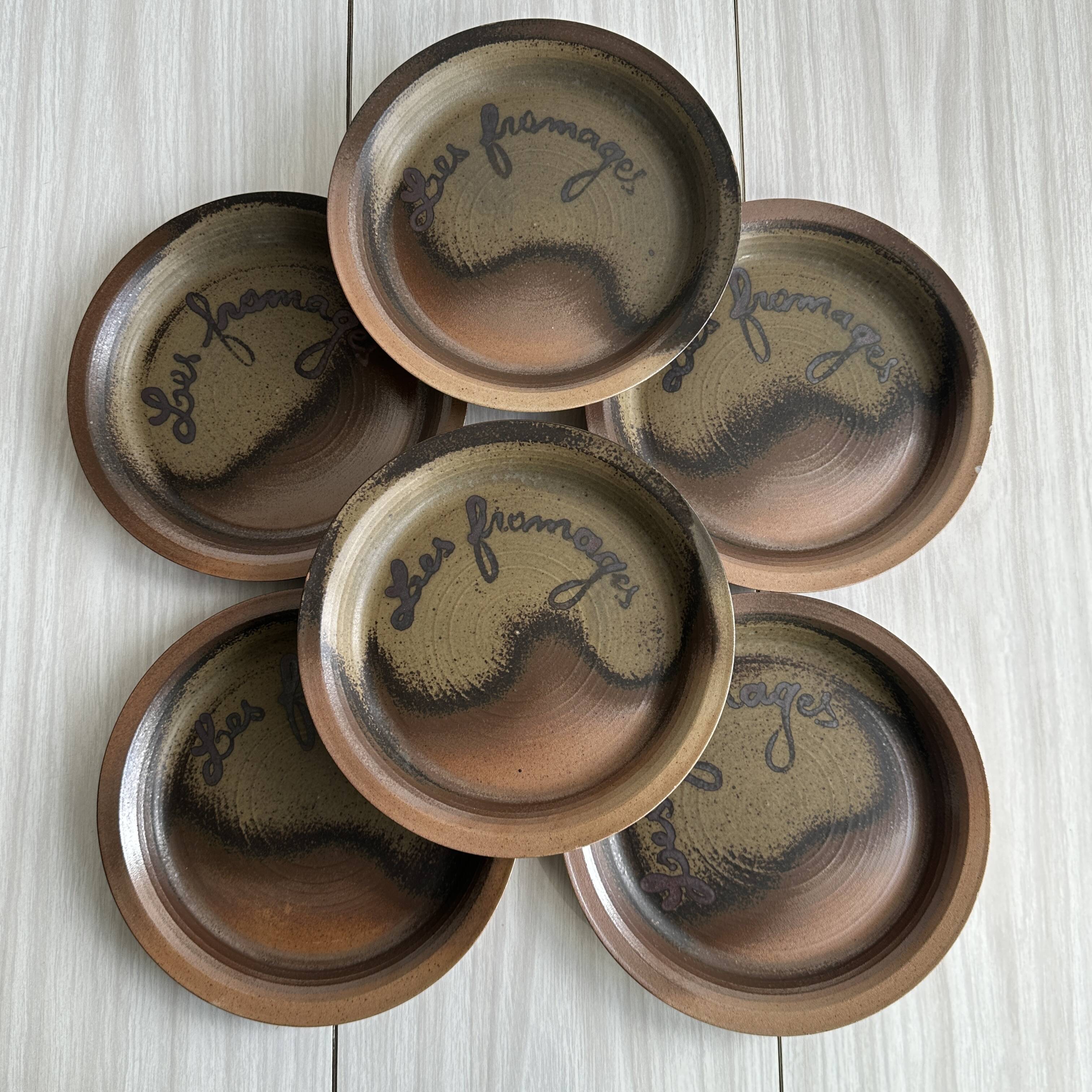 6 Arnon stoneware cheese plates.