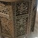 Ancient oriental pedestal table in carved wood