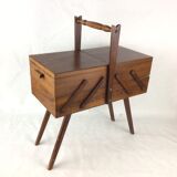 Worker on wooden compass feet