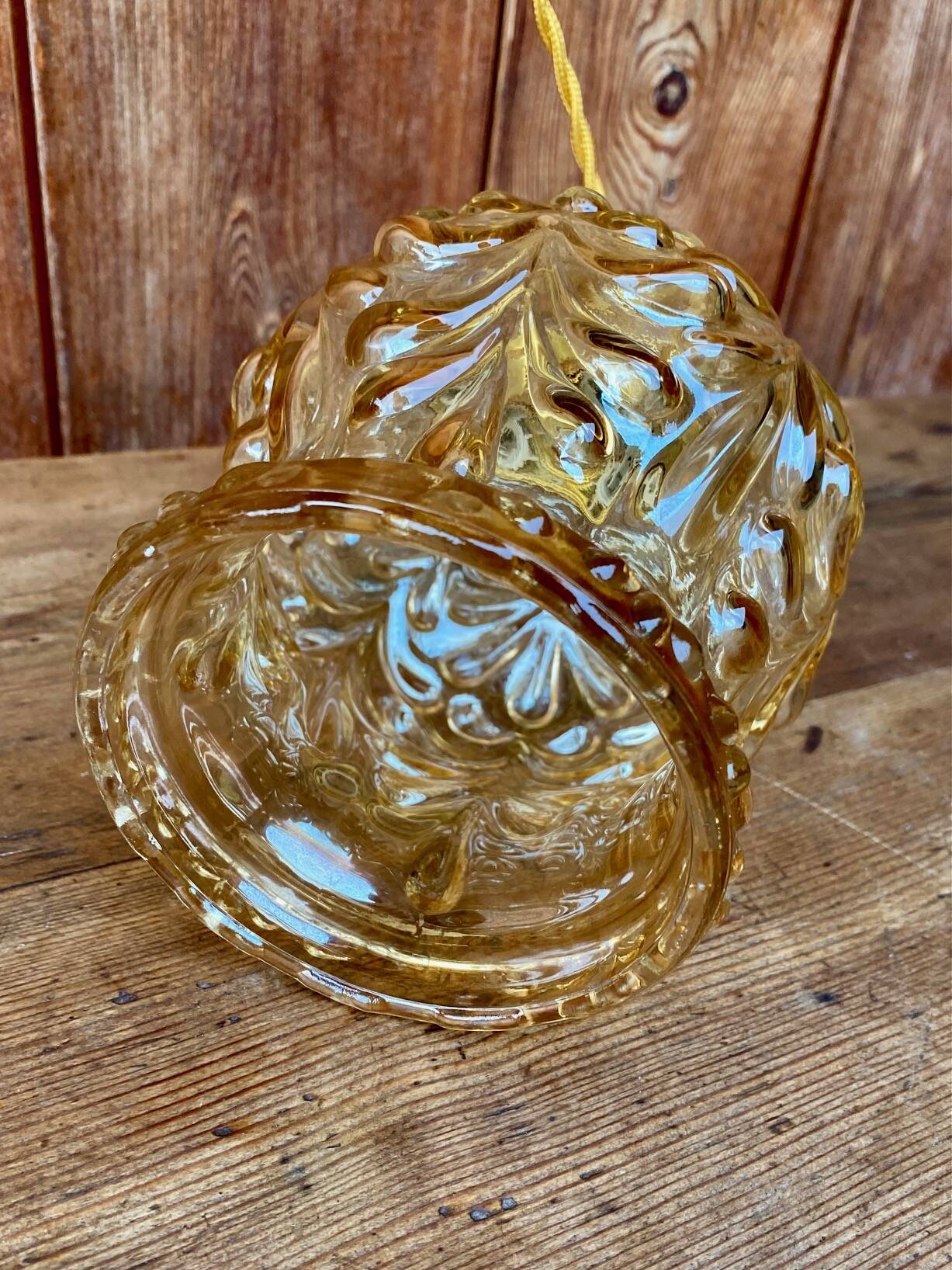 Vintage cut amber glass suspension globe.