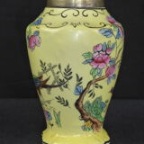 Old yellow ceramic vase decorated with flowers and a pheasant