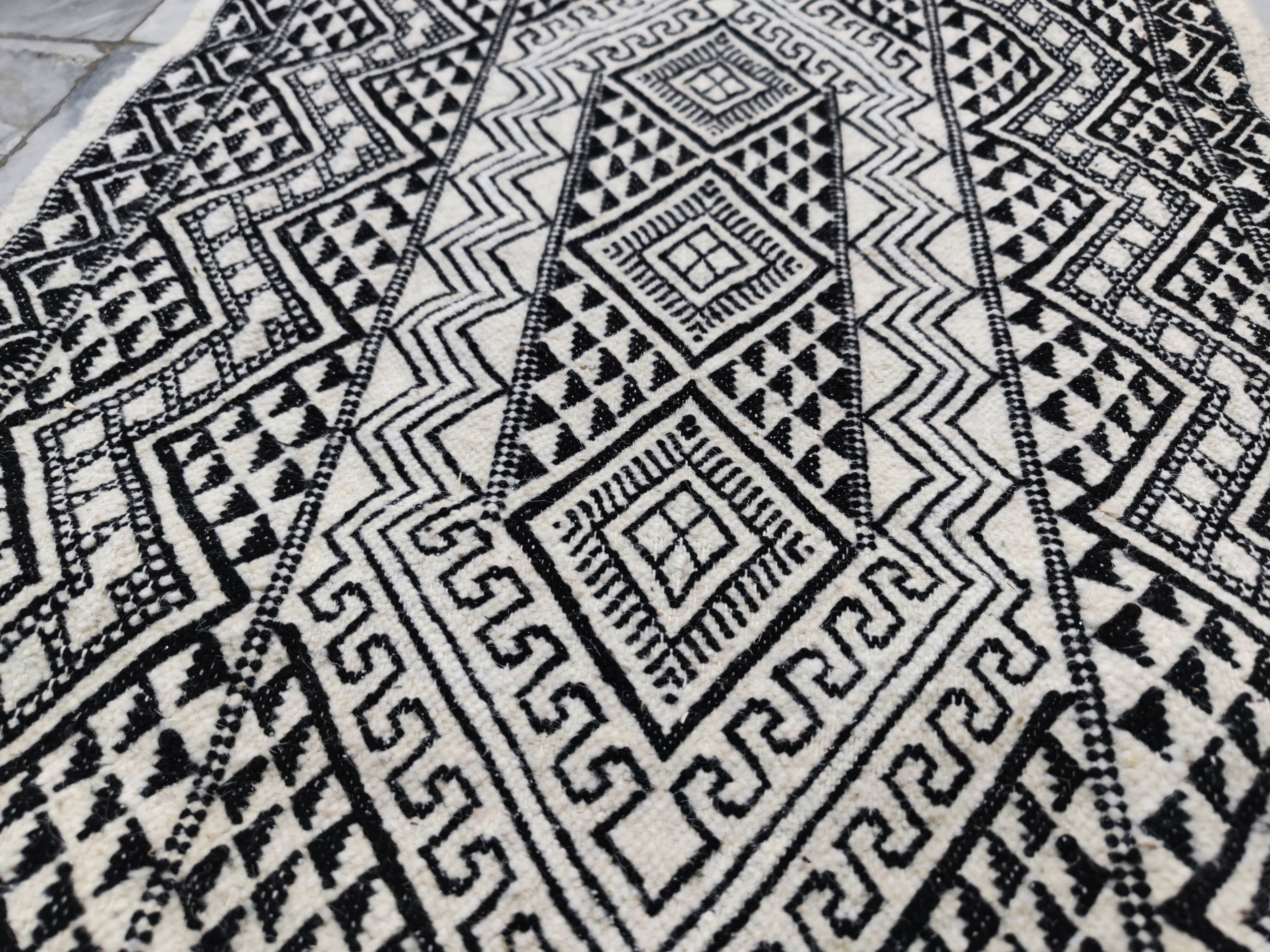 Handwoven black and white rug