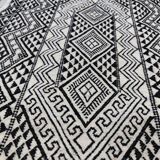 Handwoven black and white rug