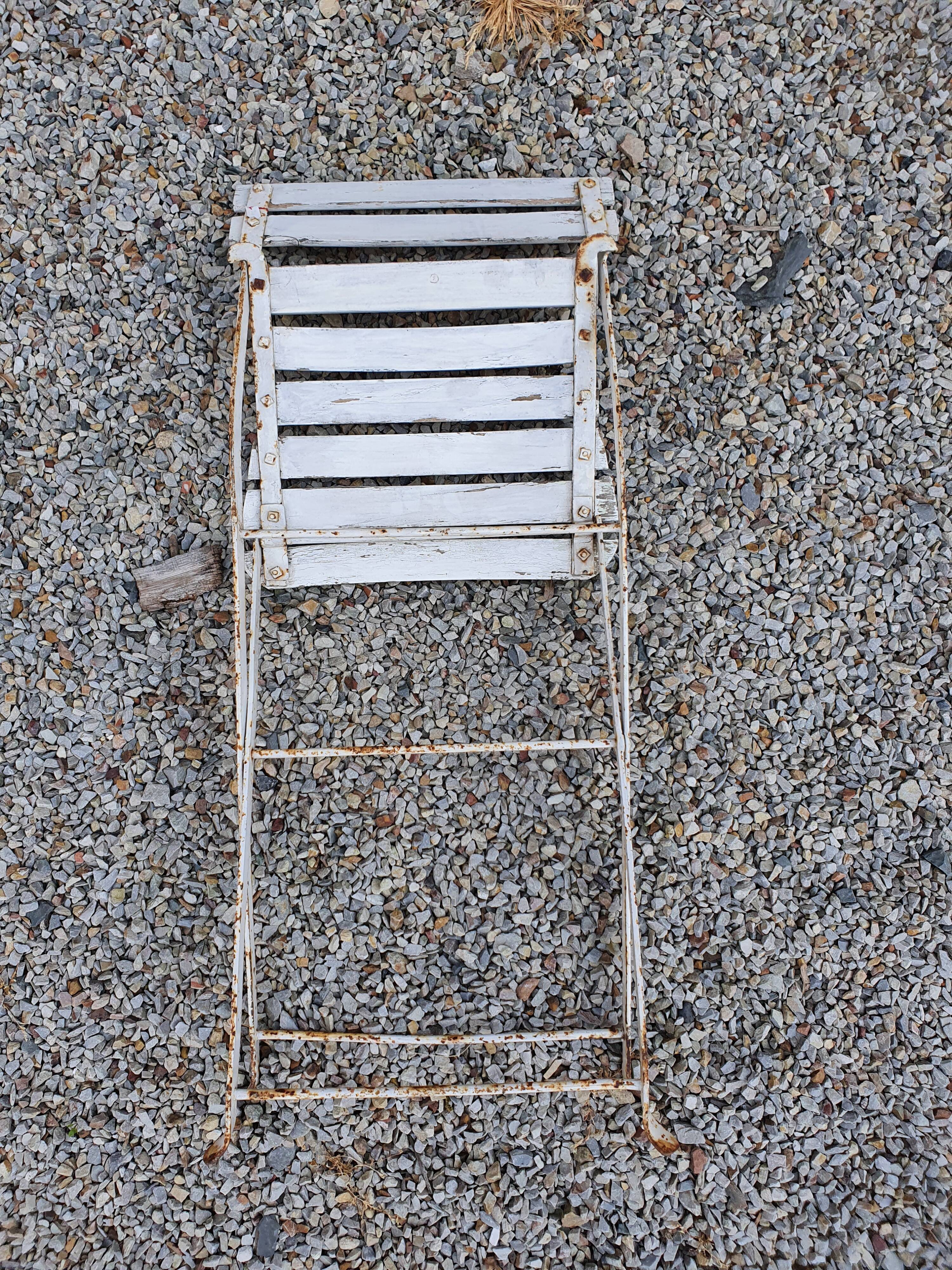 Wooden slatted garden chair with wooden slats and iron feet