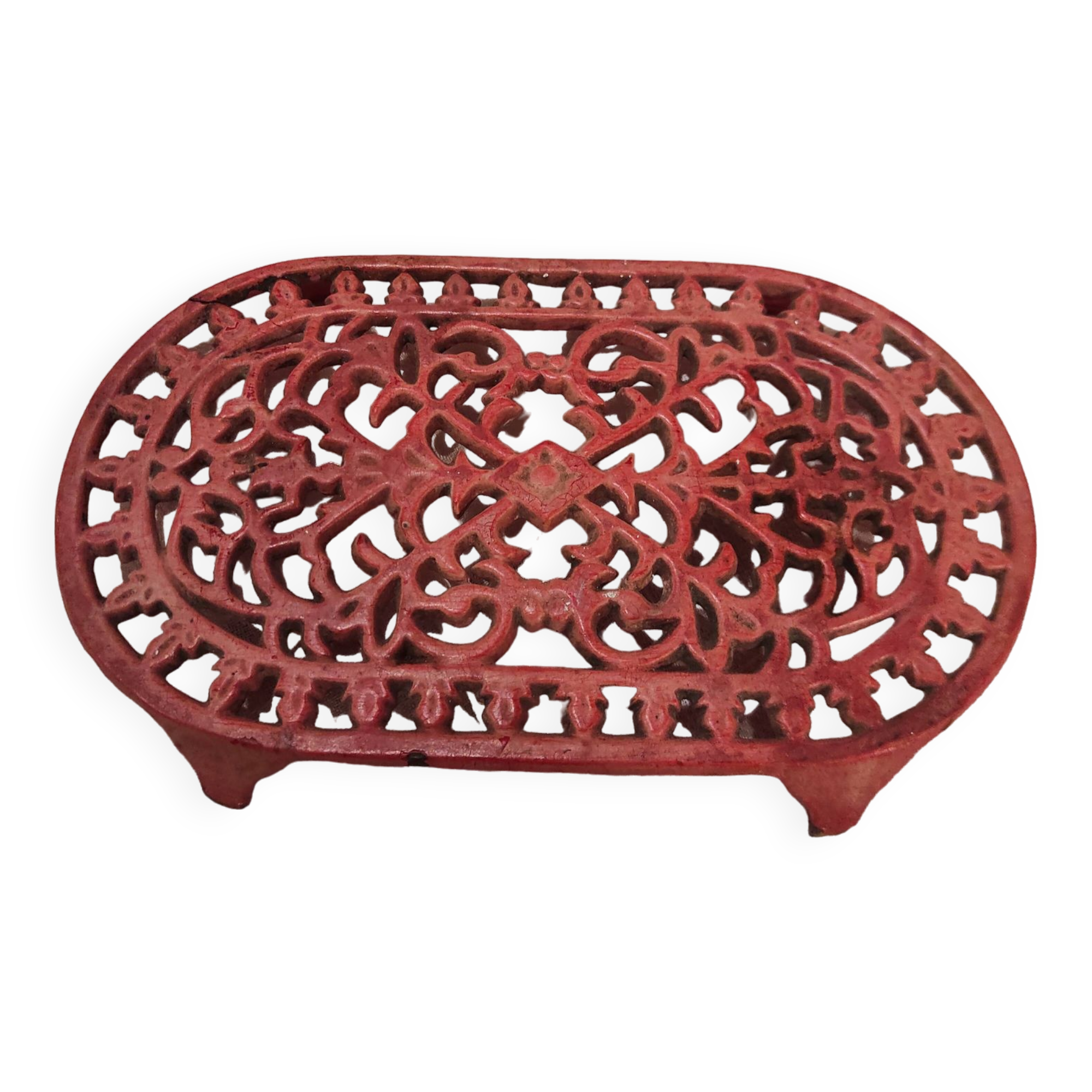 Vintage oval dark coral pink cast iron trivet