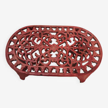 Vintage oval dark coral pink cast iron trivet