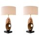 Pair of patinated brass table lamps with black granite base.