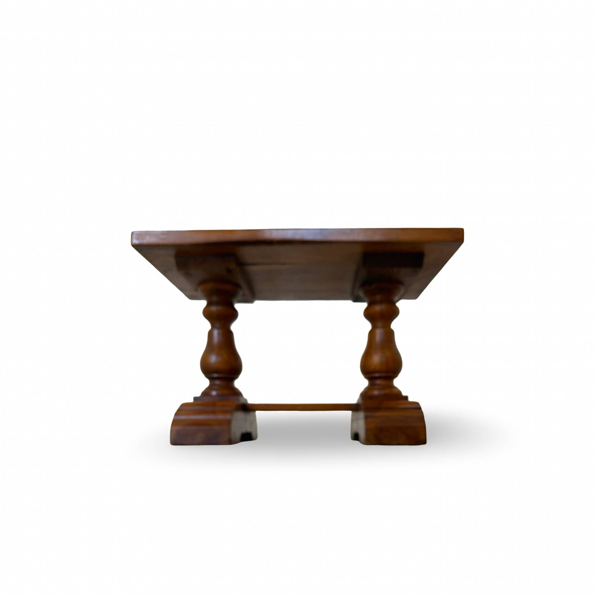 A small, rustic walnut wooden table, crafted from solid walnut wood, 1
