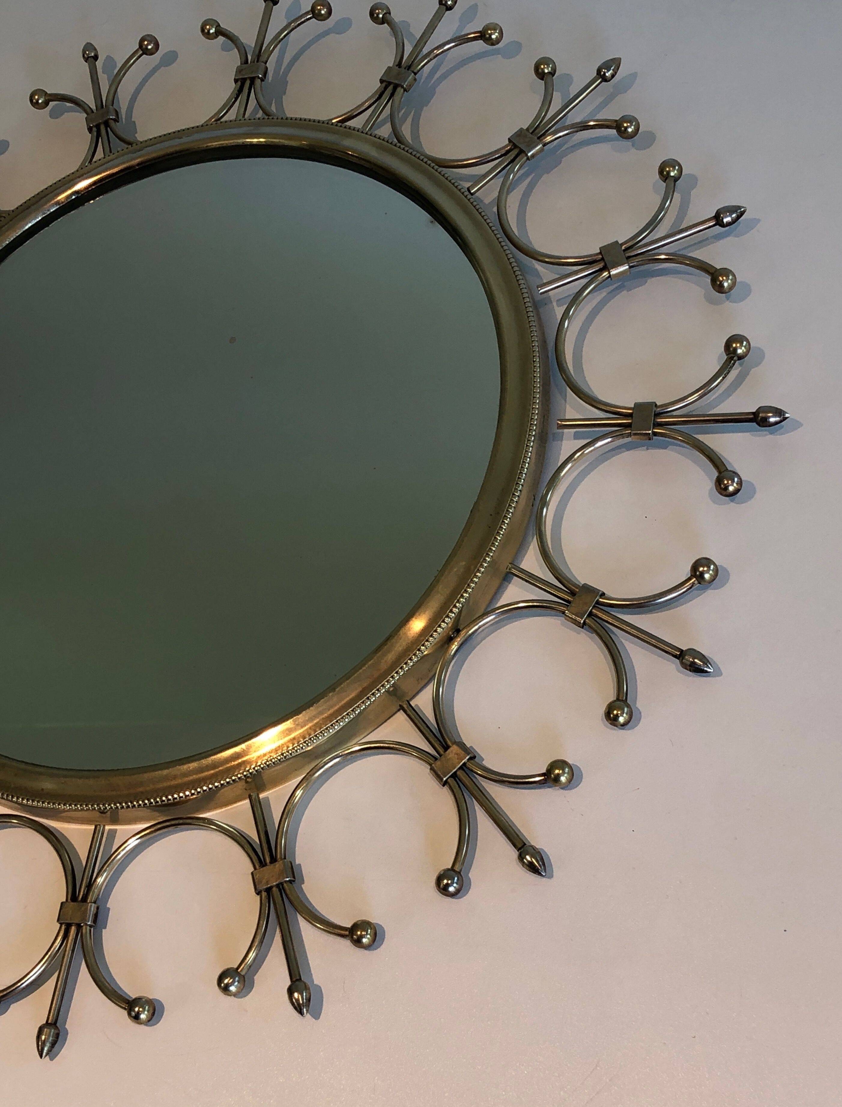 Sun mirror in brass and brushed steel