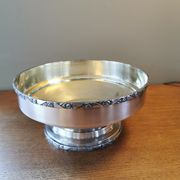 Art Deco coupe on a silver-plated metal stand.