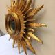 Sun mirror in carved gilded wood from the 1950s