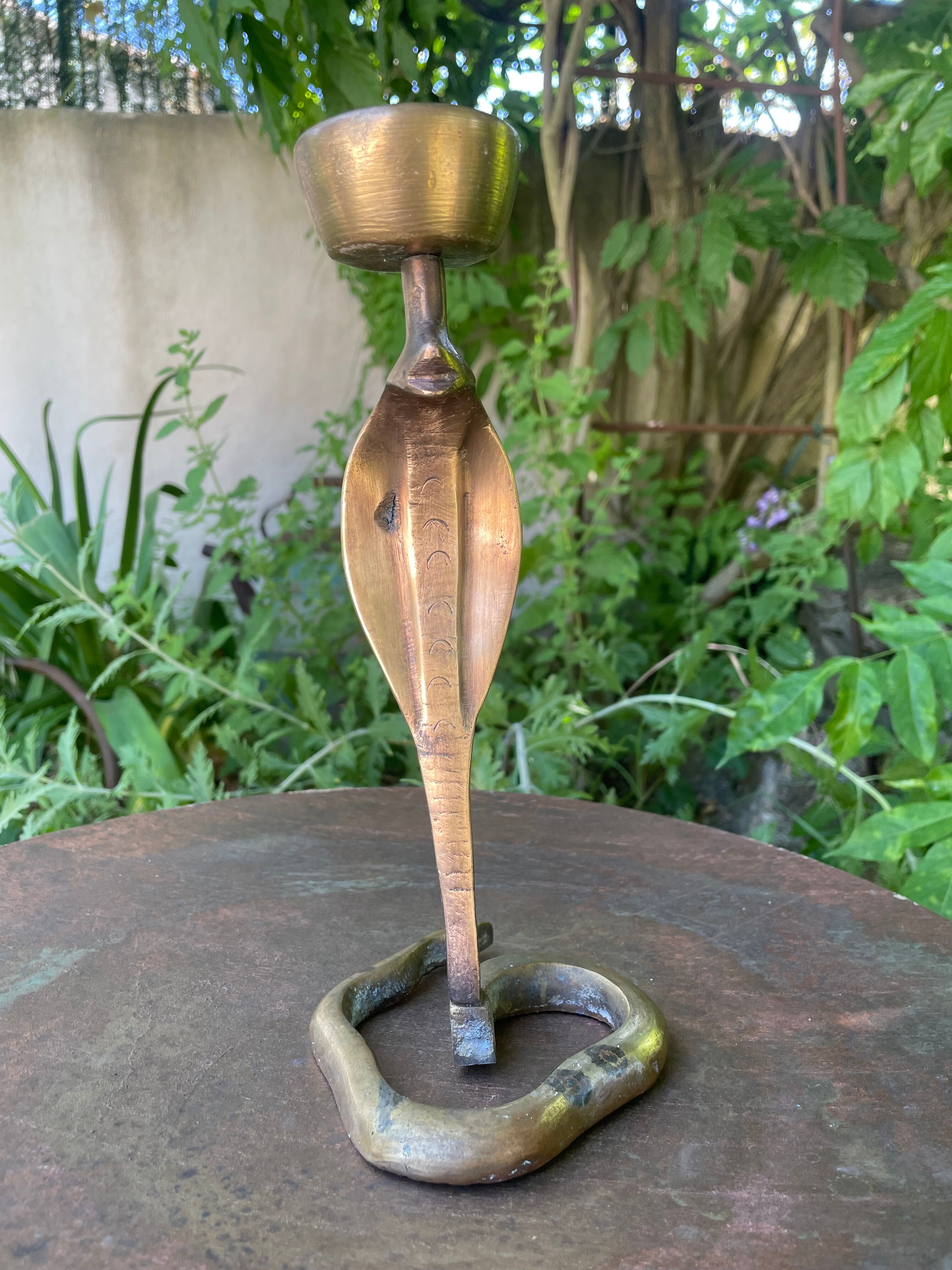 Cobra candlestick in Latvian