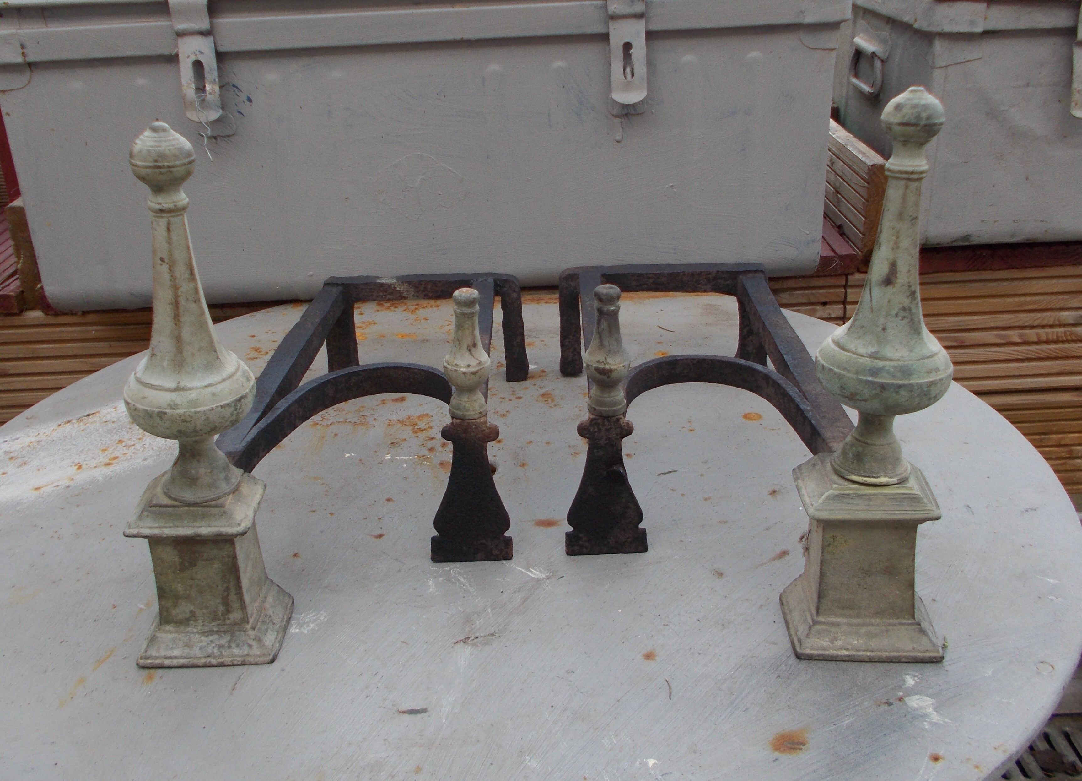 Old pair of wrought iron and bronze pegs