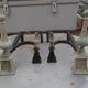 Old pair of wrought iron and bronze pegs