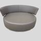 Circular rotating leather canapé with 6 cushions.