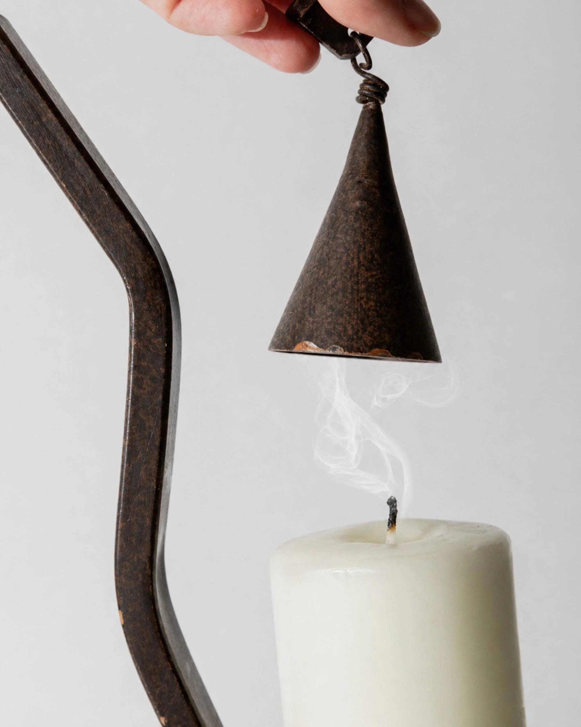 Vintage wrought iron candlestick from the 1960s, zigzag design with removable snuffer.