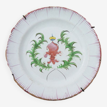 Old faience plate with wall support: fleur de lys