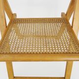 Pair of vintage folding chairs in beech and canework. Italy 70s