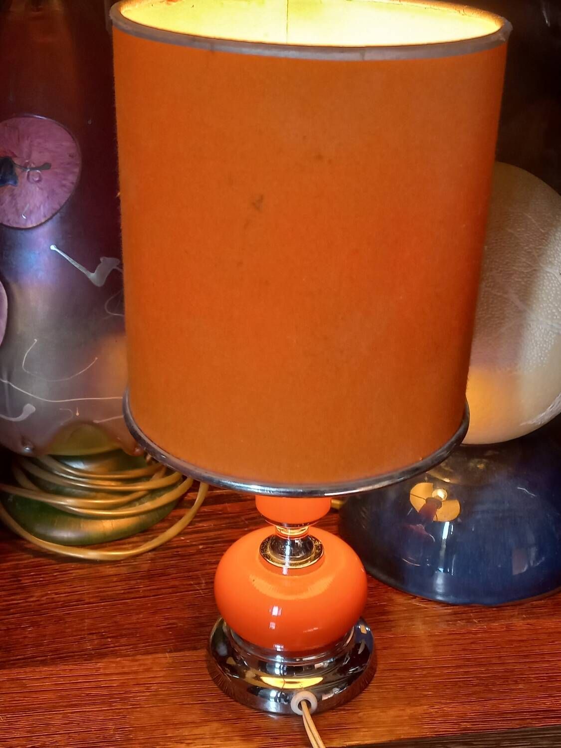 Designer lamp from the 70s in chrome metal and orange lacquered wood