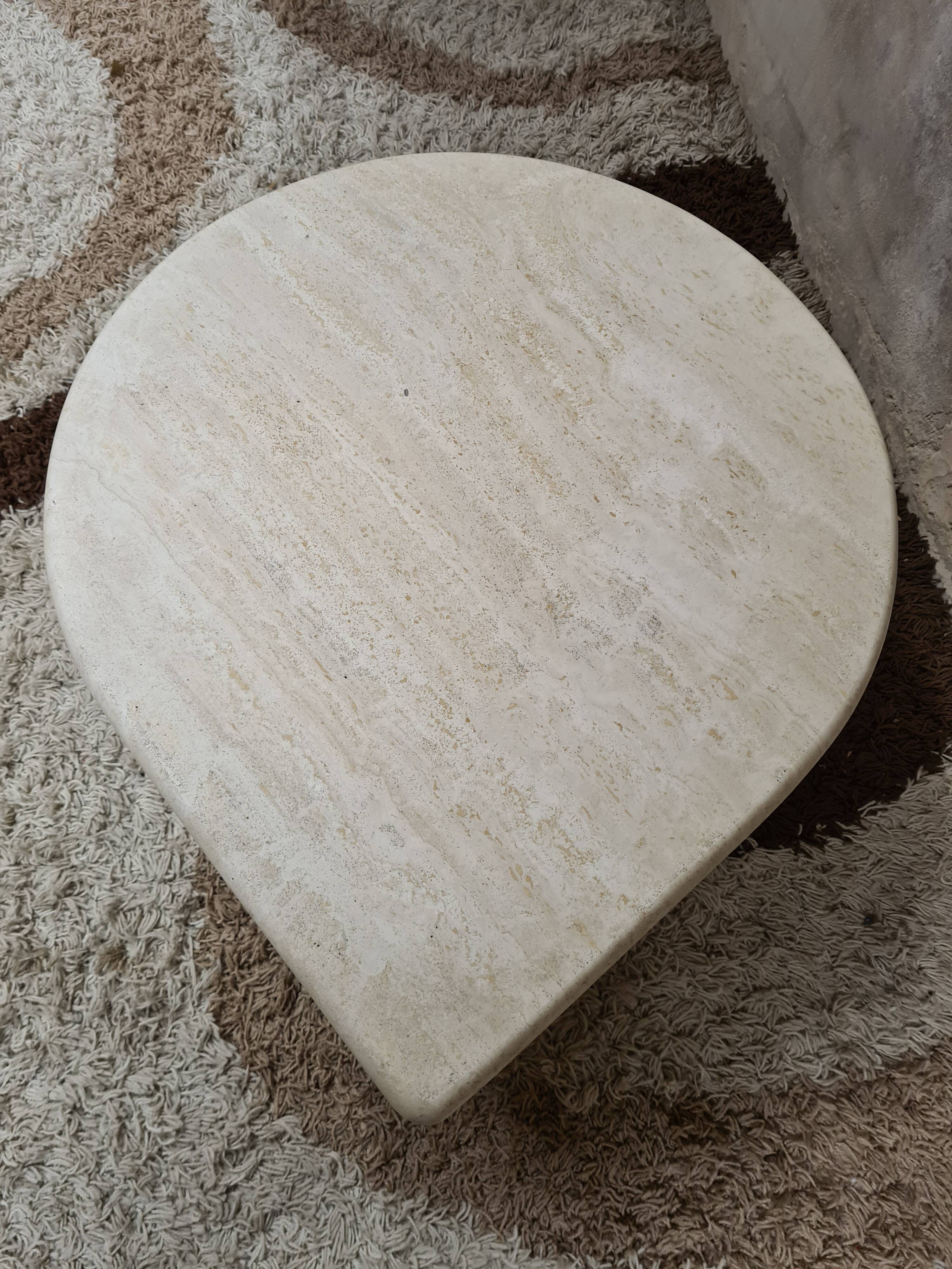 Travertine drop-shaped coffee table