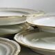 12 Limoges porcelain dessert plates, gold decoration.