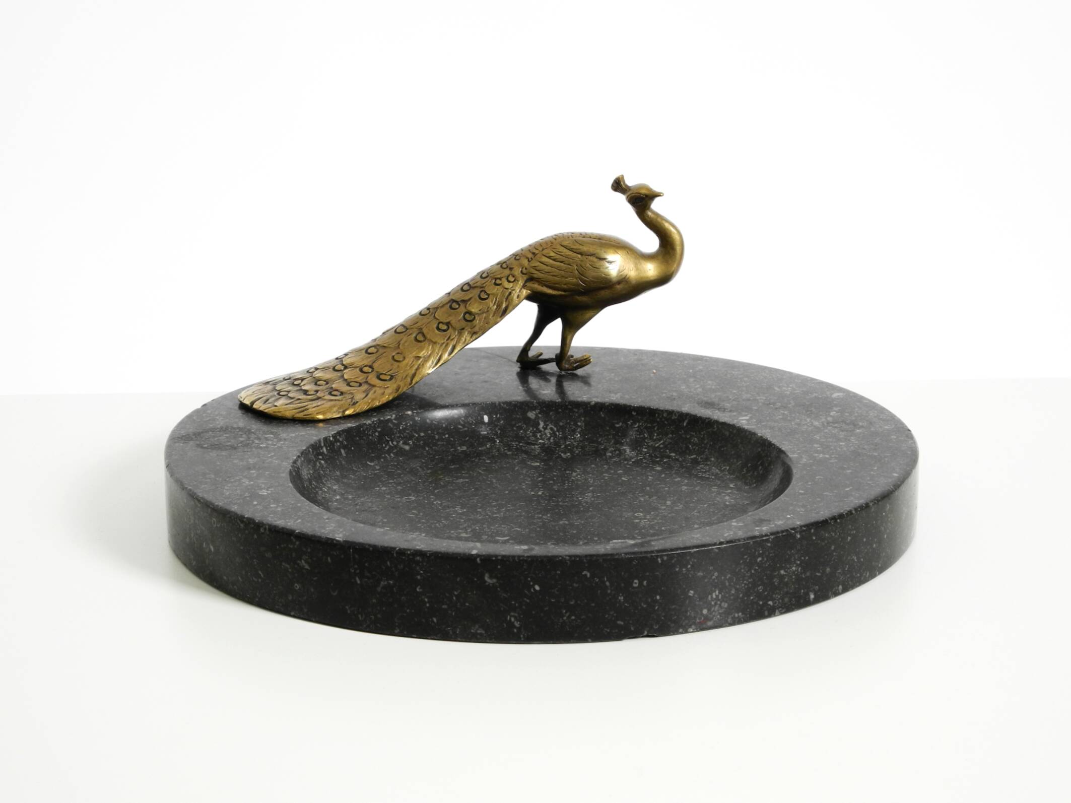 Beautiful, large black granite valet tray featuring a brass peacock, circa