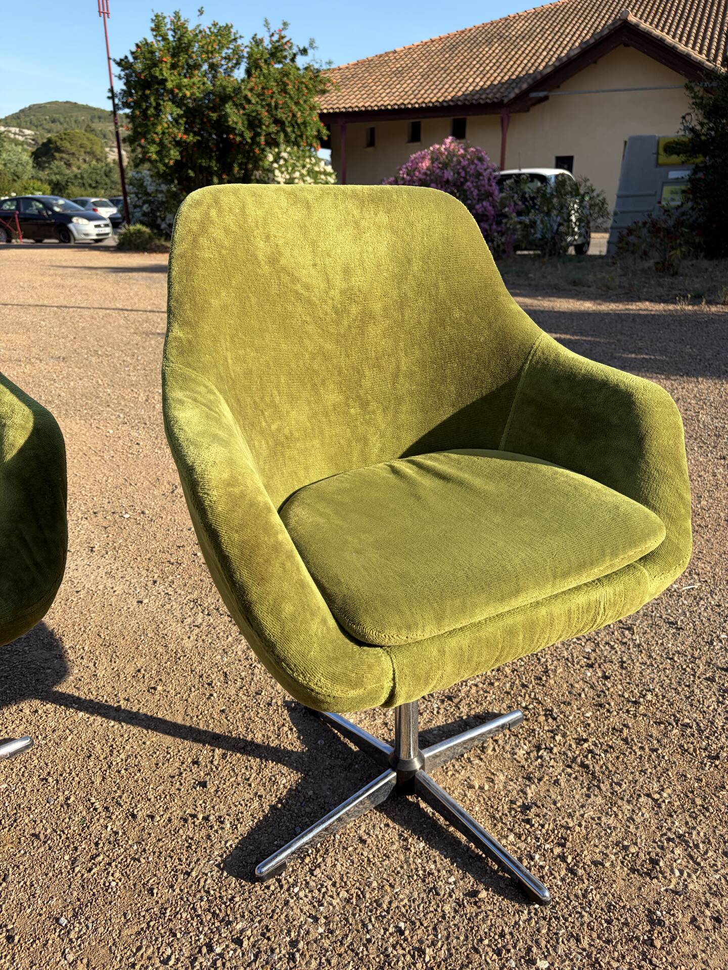 Vintage 1960s Lubke green velvet swivel armchair pair.