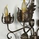 Wrought iron wall lights (pair) with foliage decoration