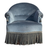 Fauteuil crapaud vintage en velours bleu, un intemporel confortable