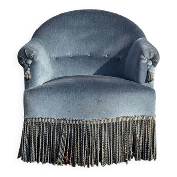 Fauteuil crapaud vintage en velours bleu, un intemporel confortable
