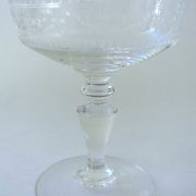 Suite of six champagne glasses on foot in engraved colorless crystal
