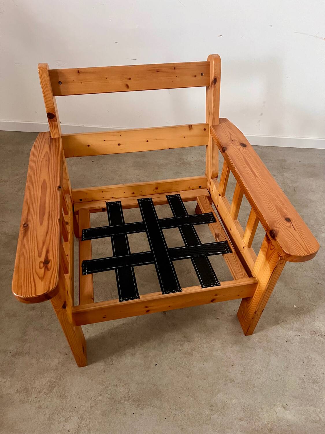 Old vintage Scandinavian design pine armchair from the 70s