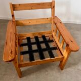 Old vintage Scandinavian design pine armchair from the 70s