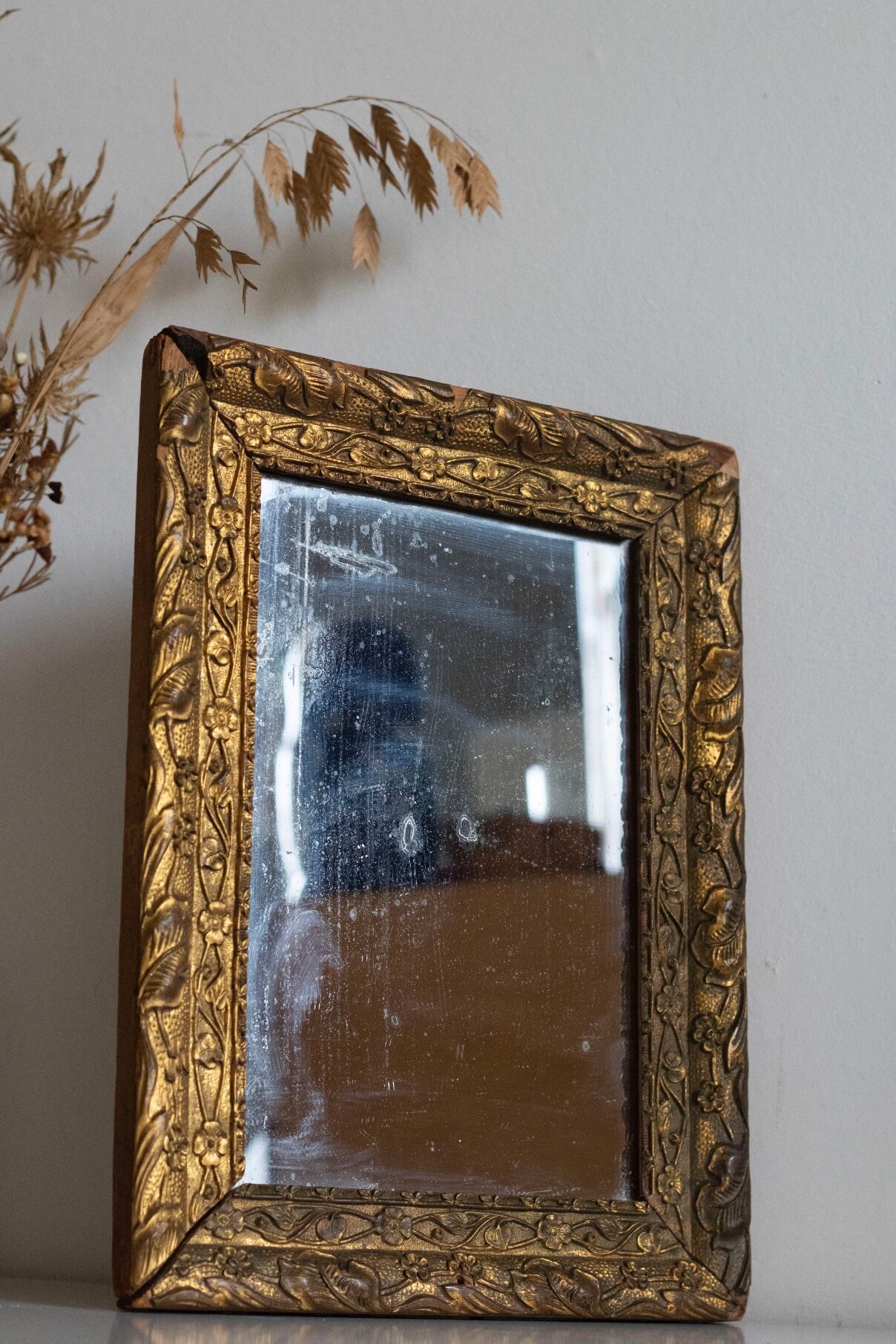 Antique mirror in gilded wood