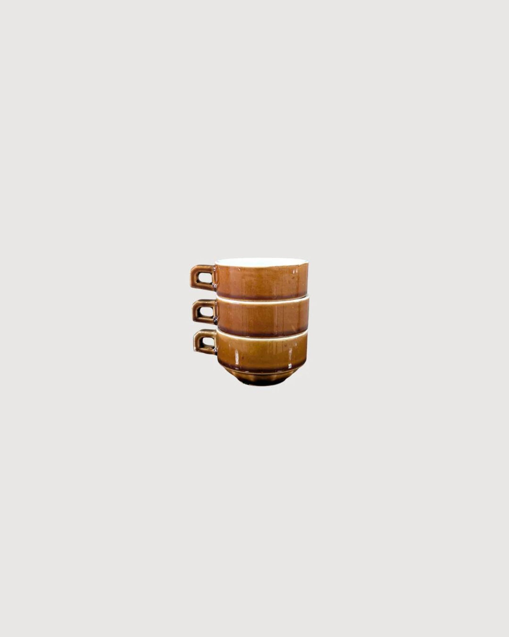 Trio of brown stoneware cups