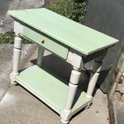 Rustic wooden dining table painted white and pale green, with a central drawer, 1950s.
