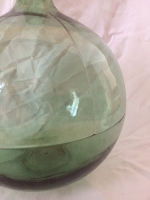 Demijohn old transparent green, estimated capacity around 12 to 15L