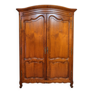 Linen cupboard in cherry wood in Louis XV style with two doors.