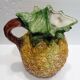 Pitcher on pineapple earthenware