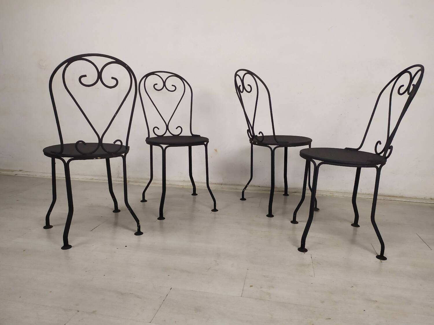 4 black garden chairs