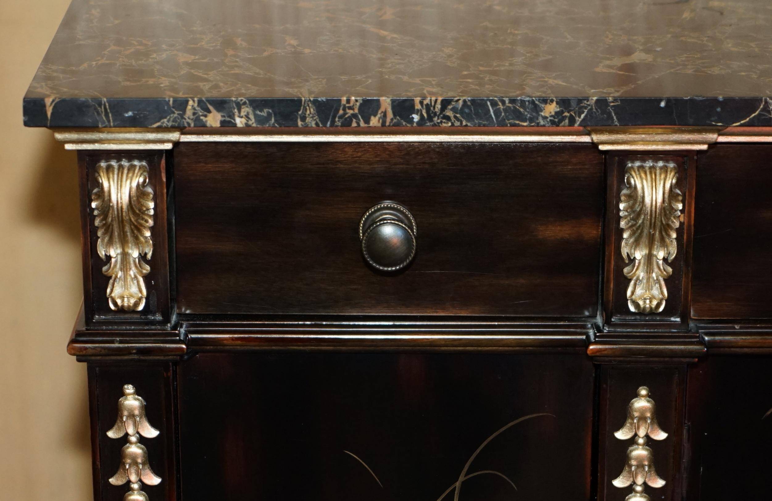 Contemporary Chinese buffet with a marble top and space for a mini-fridge.