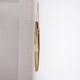 Hanging mirror in gilded brass