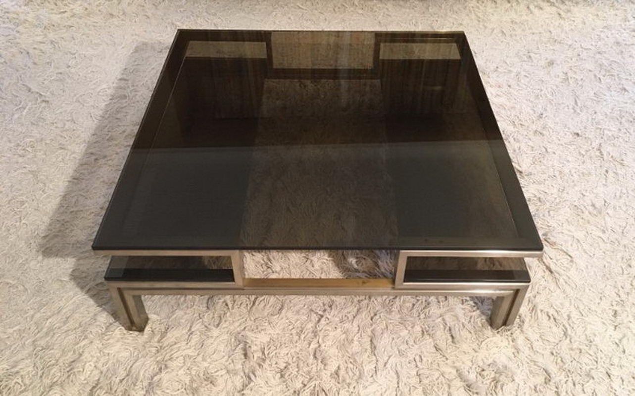 Very nice coffee table in brushed steel and brass
