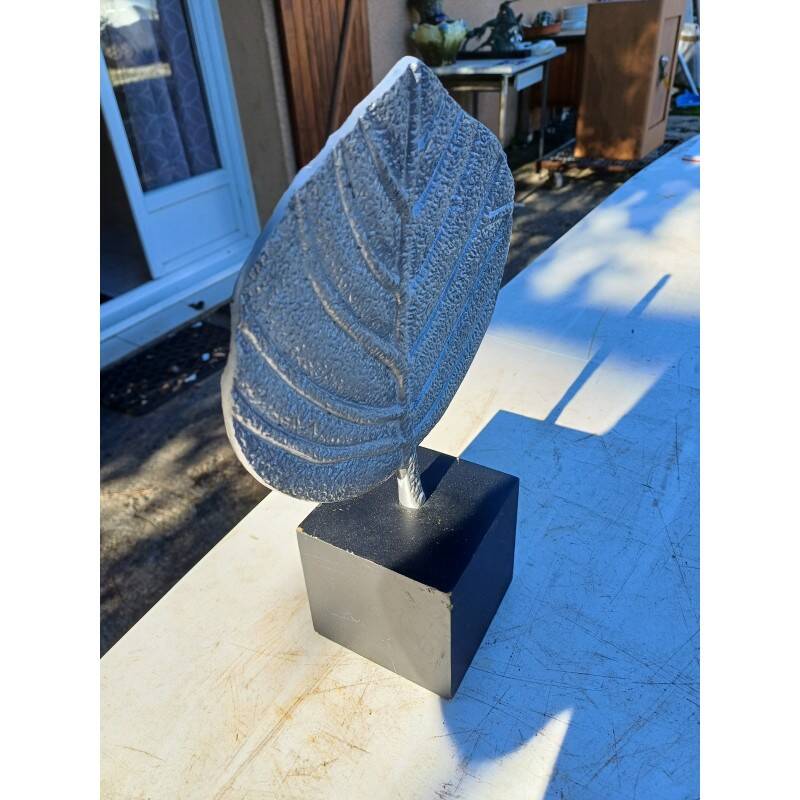 Vintage aluminum leaf decoration on wooden base