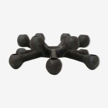 Jens Quistgaard, small cast iron candle holder and its 12 candles, Dansk Design, 1960s.