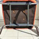 The 1970s orange armchair fabric and chrome metal